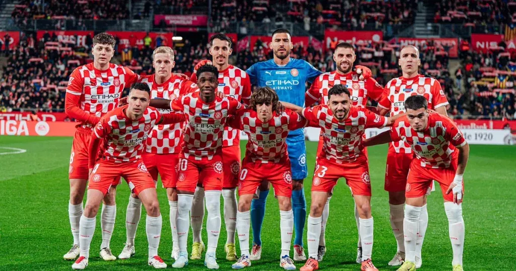 Girona players pose for a team photo ahead of their game against Real Madrid