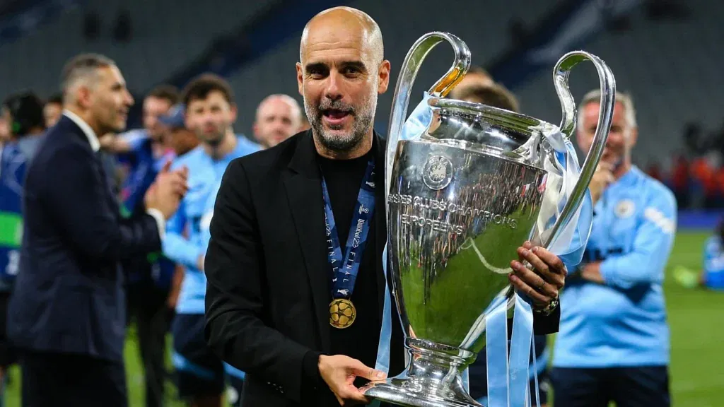 Pep Guardiola celebrating Manchester City's first UCL.