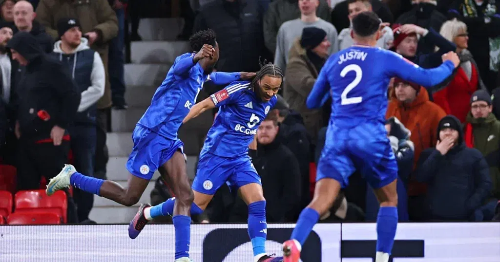 Leicester City players celebrating a goal against the Red Devils