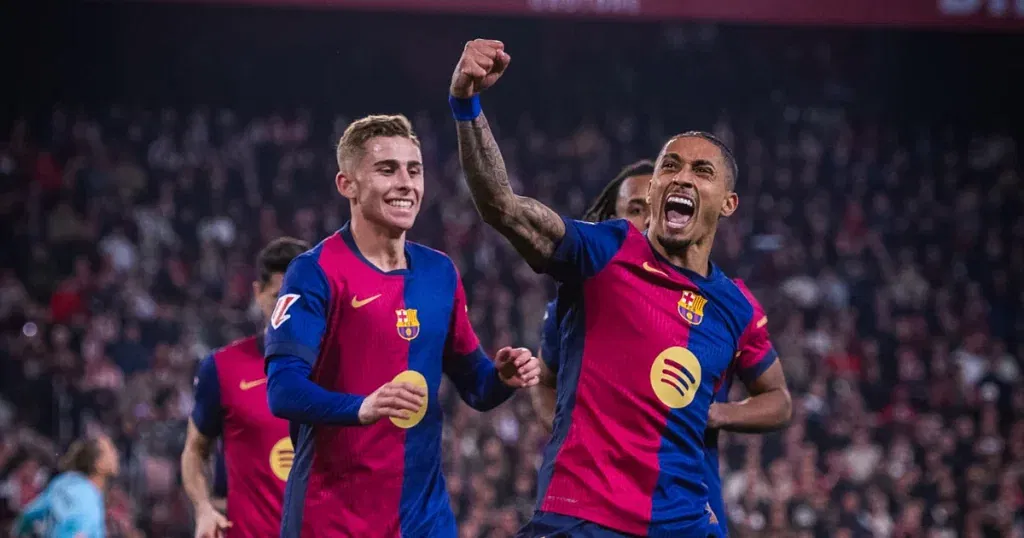 Barcelona players celebrate one of their goals against Sevilla